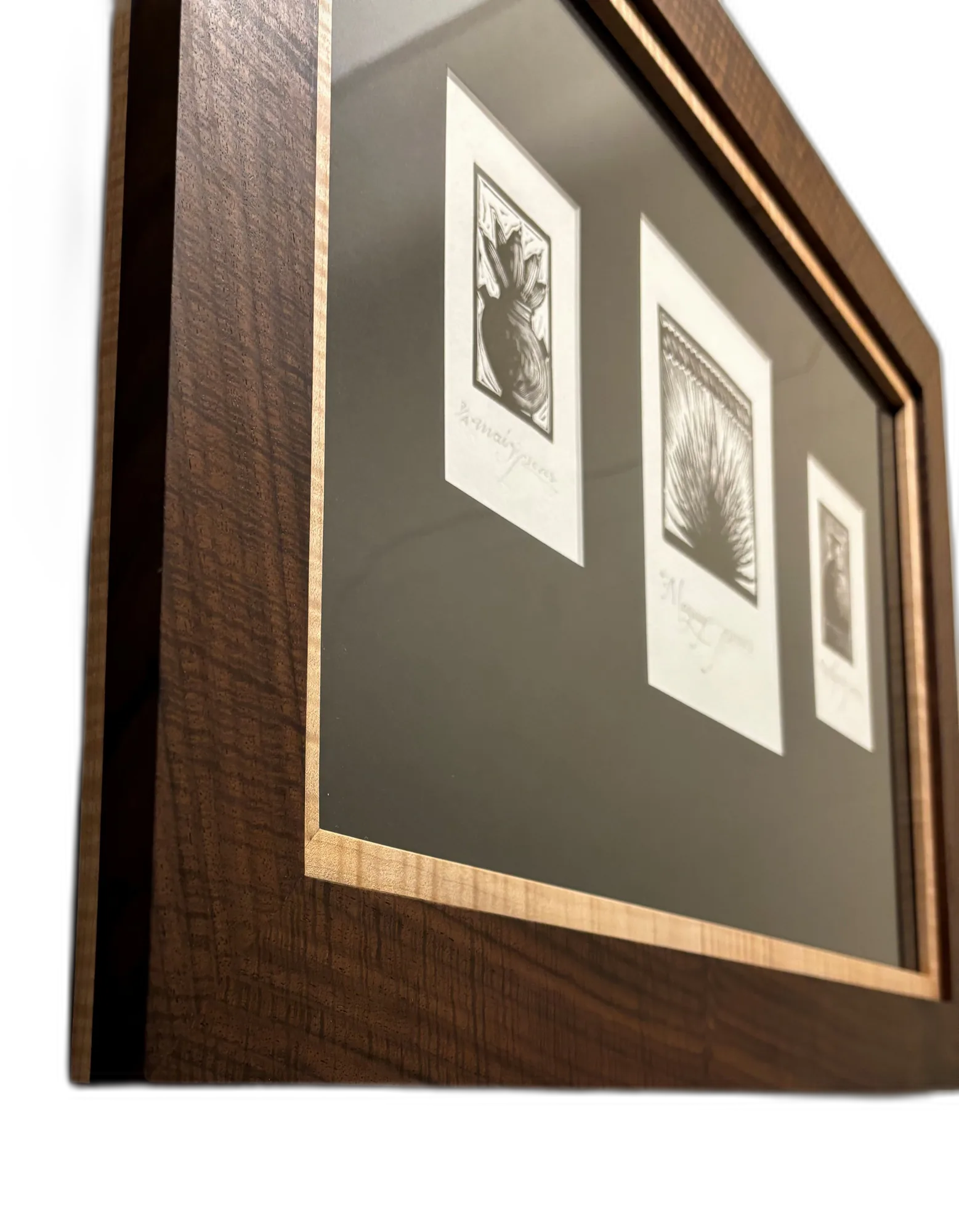 Walnut frame with inlaid border around botanical prints